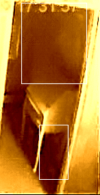 Animated captured picture from doll house cam on February 12, 2009 by Mytharasmom. Top square is a woman's profile with a bun and lower square is a cat walking towards cam under the desk (look at the tail)!